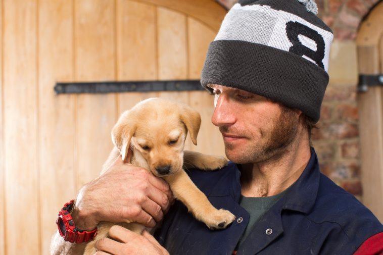Guy Martin with a puppy wearing a Bobble Hat